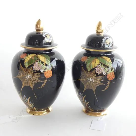 A pair of  Carlton ware famille noir enamelled ginger jars